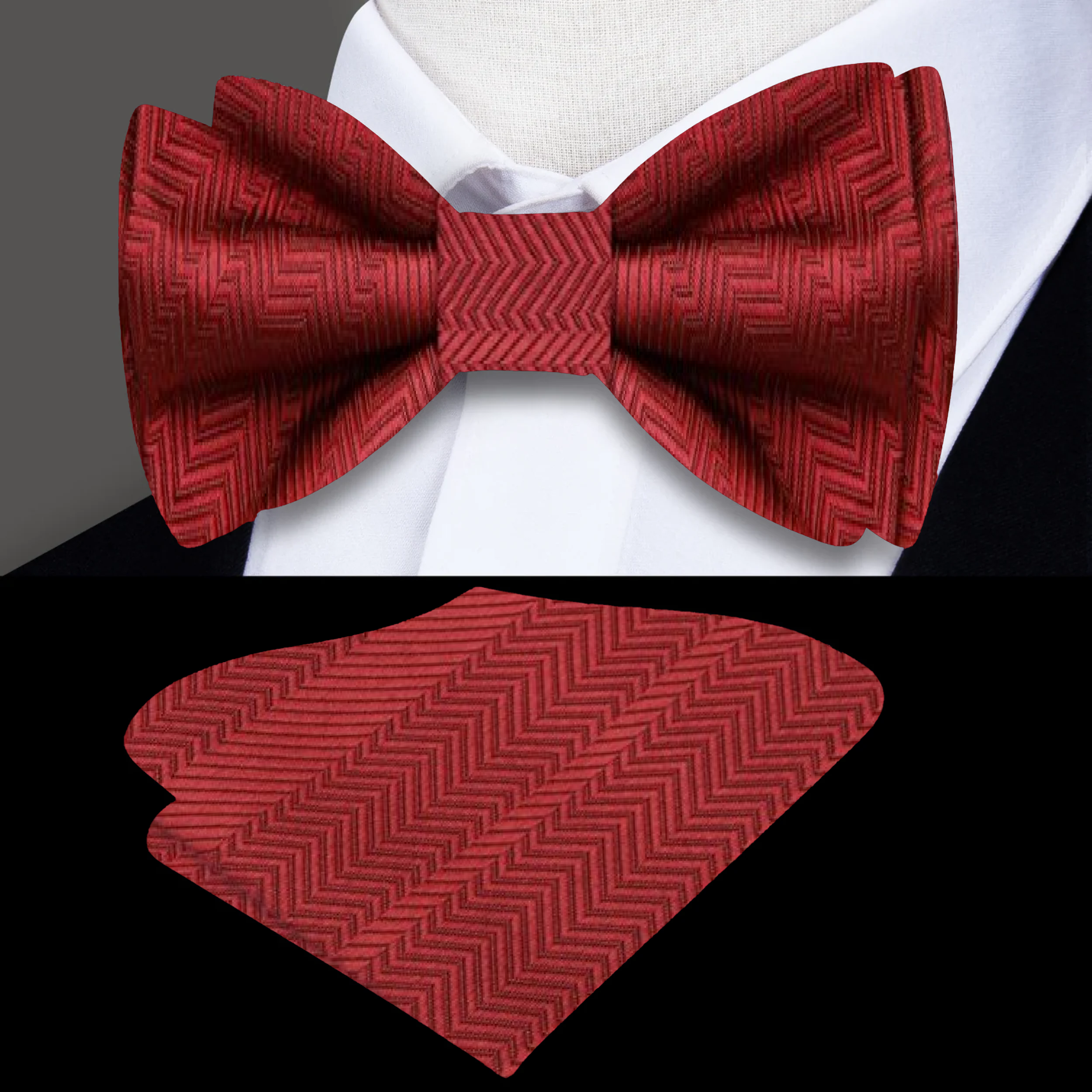 Stylish garnet red silk bow tie paired with a matching pocket square on a navy blue suit jacket, ideal for weddings.
