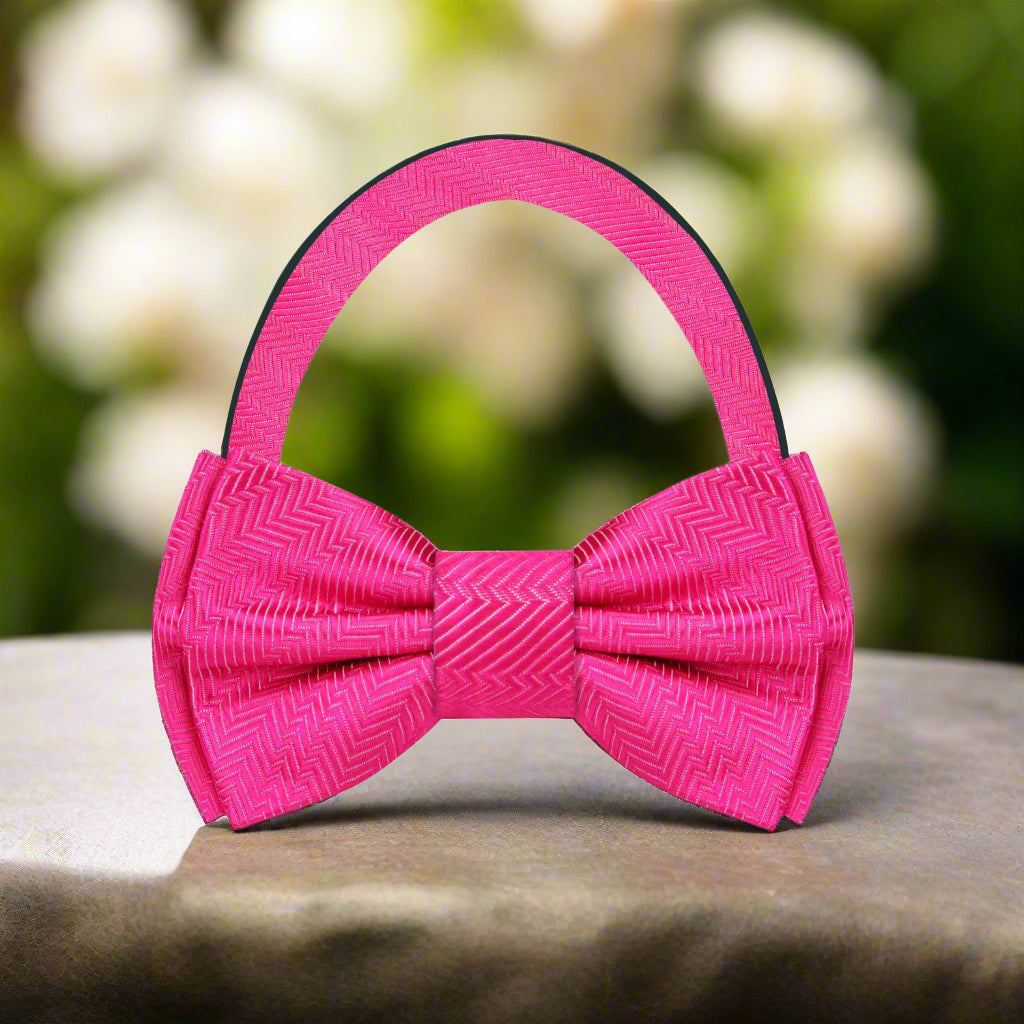 Close-up of a silk solid color bow tie with lined texture detail
