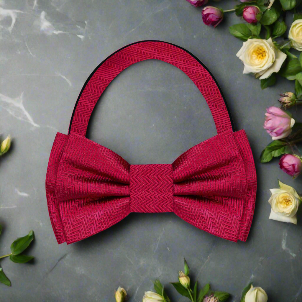 Elegant garnet red silk bow tie displayed on a classic white dress shirt, highlighting the texture and color contrast.