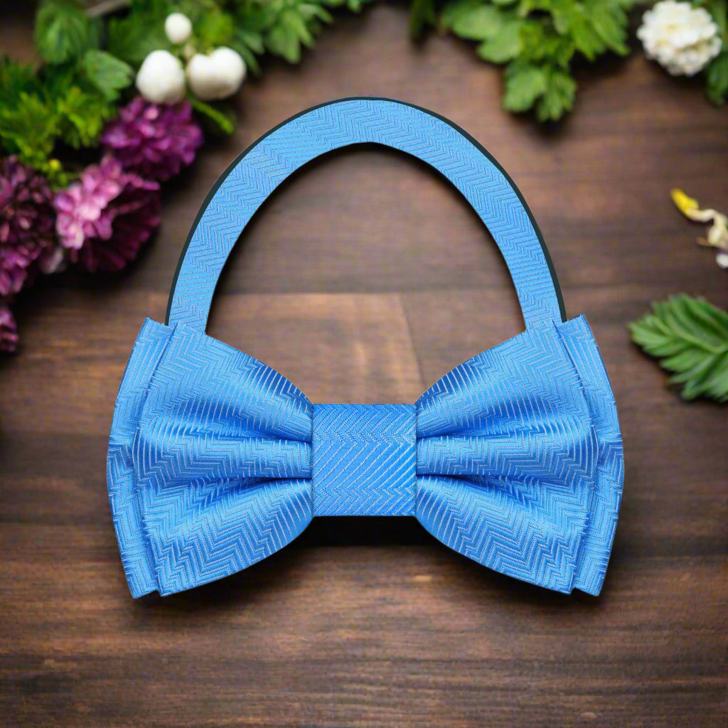 Flat lay of bow tie and pocket square set in vibrant Electric Blue
