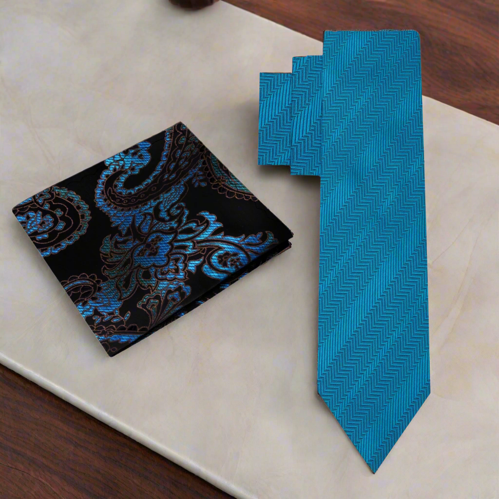 Teal silk necktie paired with a charcoal grey suit, ideal for formal events.