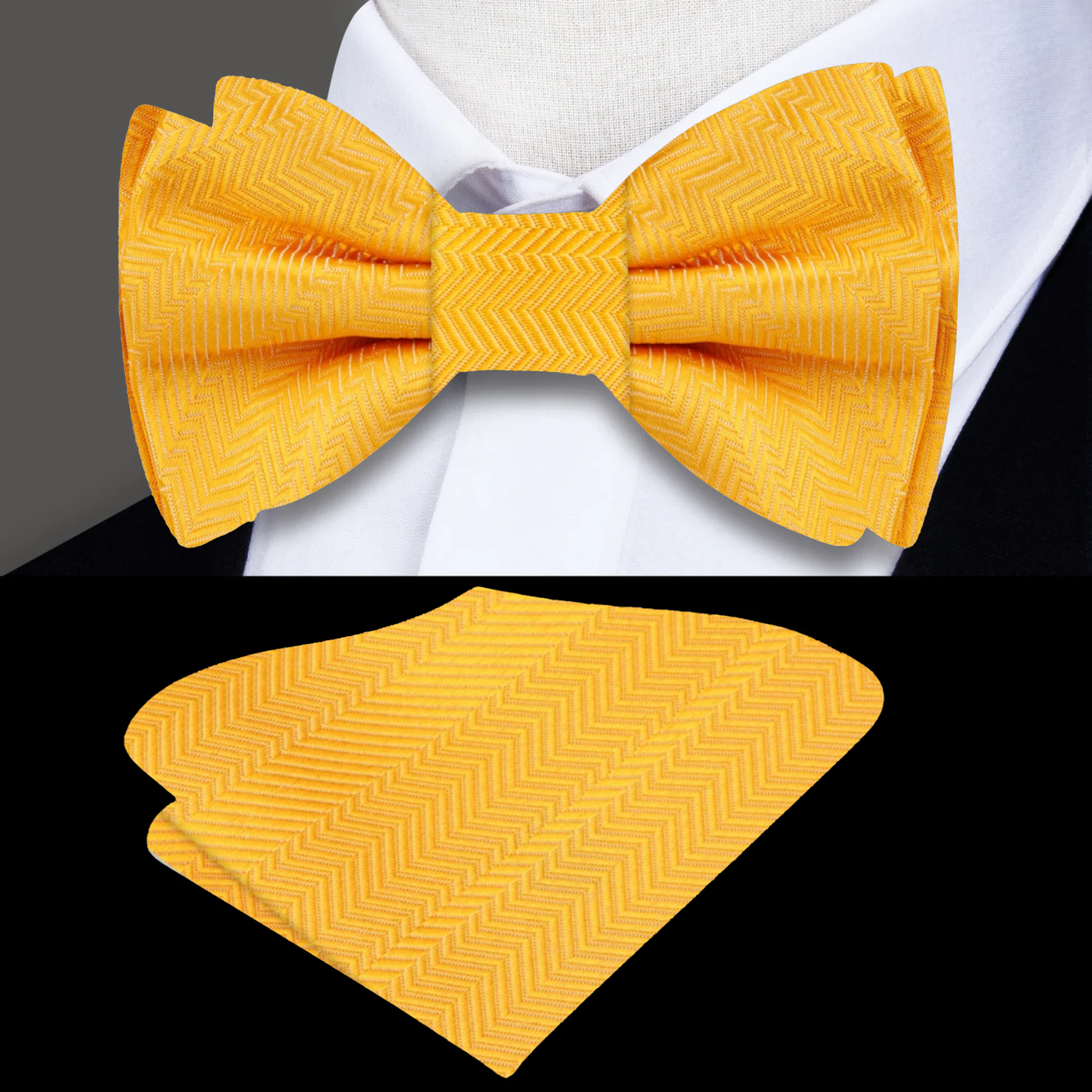 Elegant yellow bow tie with pocket square displayed on a light grey suit.