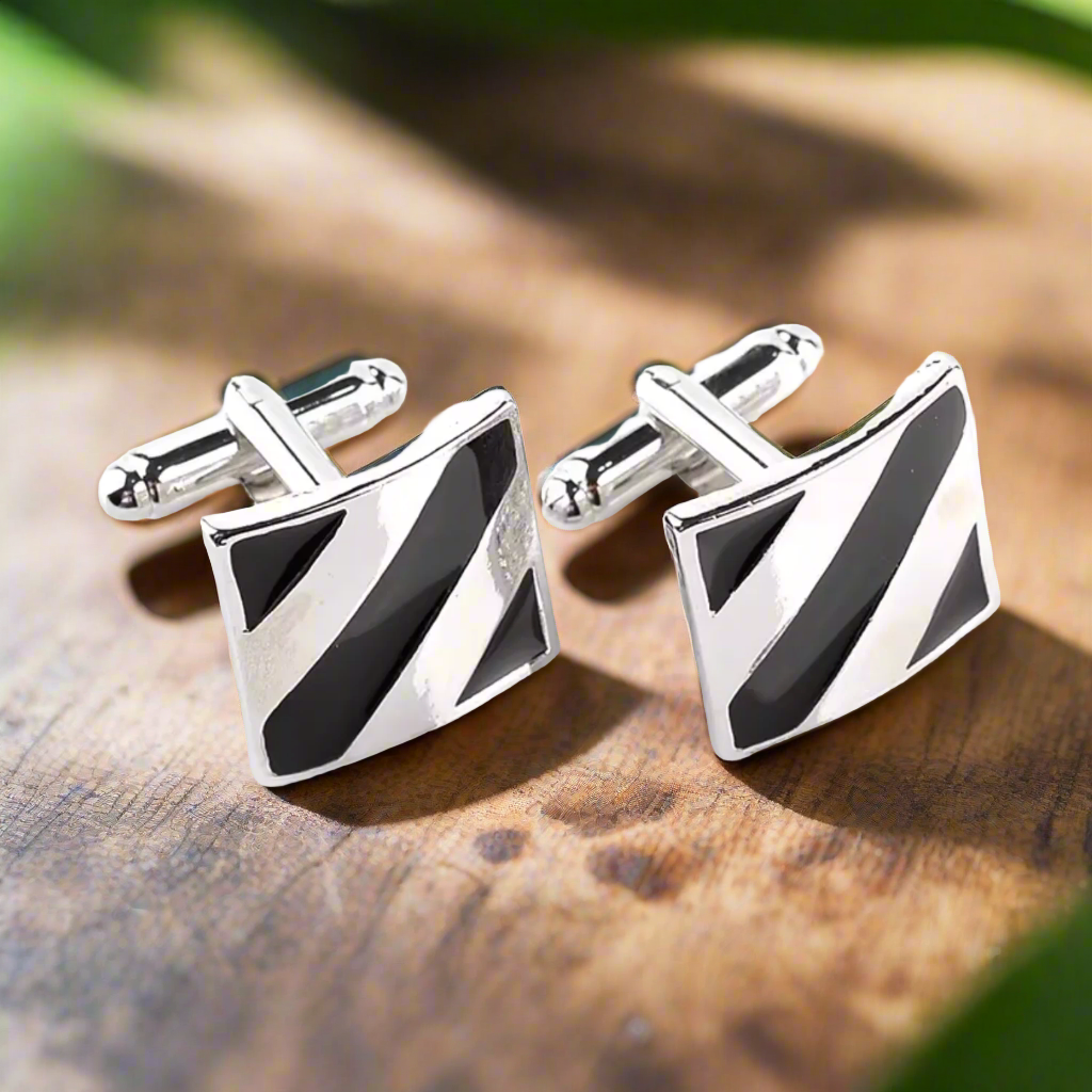 Close-up of square line cufflinks in black and chrome for formal wear