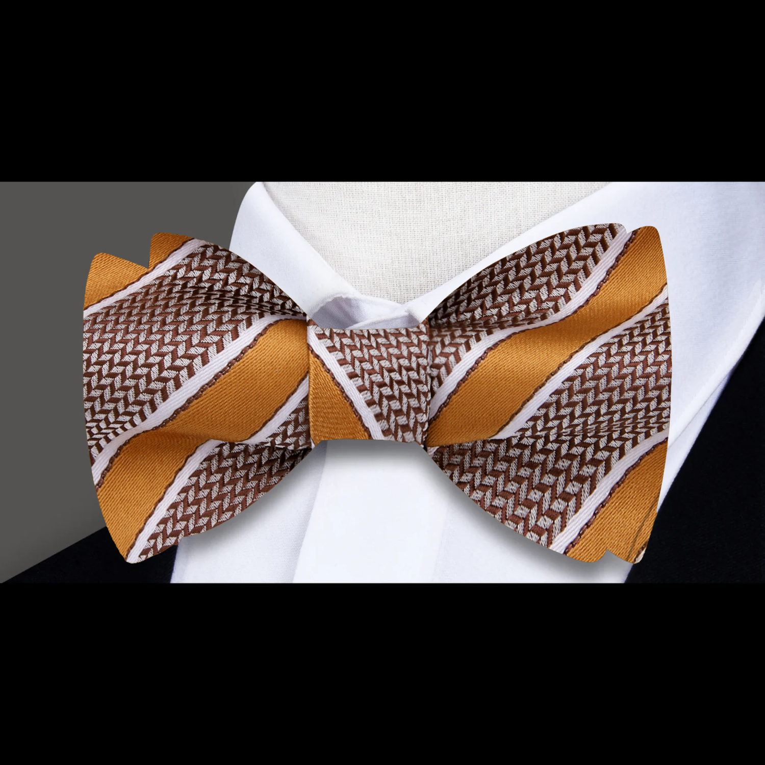 Detail close-up of bow tie texture and stitching showing soft stripe pattern