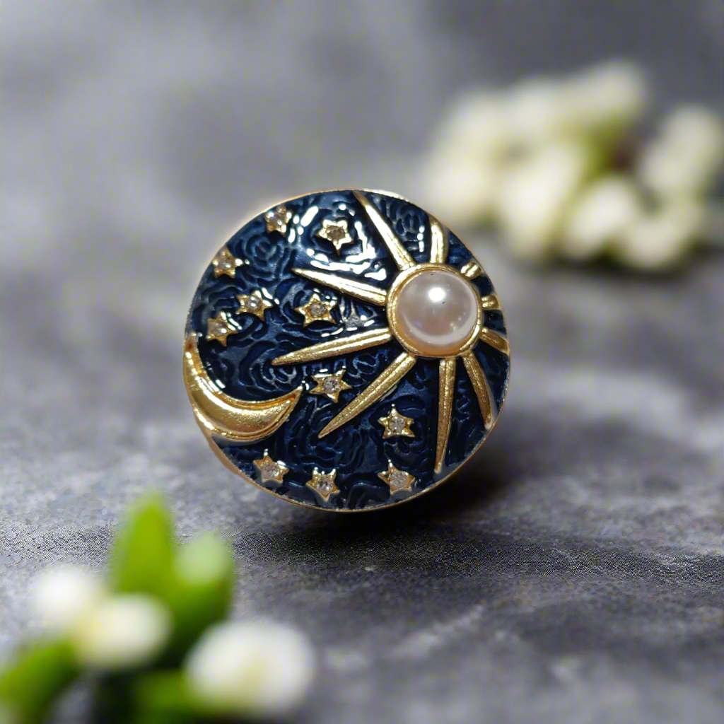 Model wearing the sun and moon pin with a navy dress shirt, highlighting its elegant look.