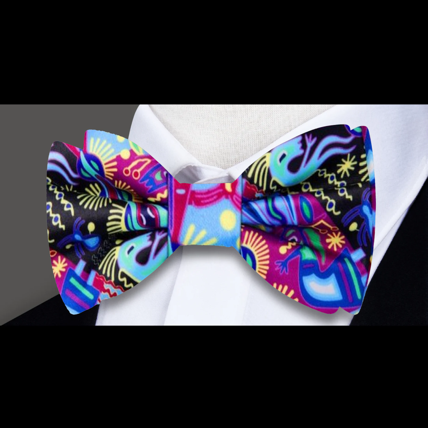 Close-up of unique silk bow tie for men with bold colors, featuring southwestern designs.
