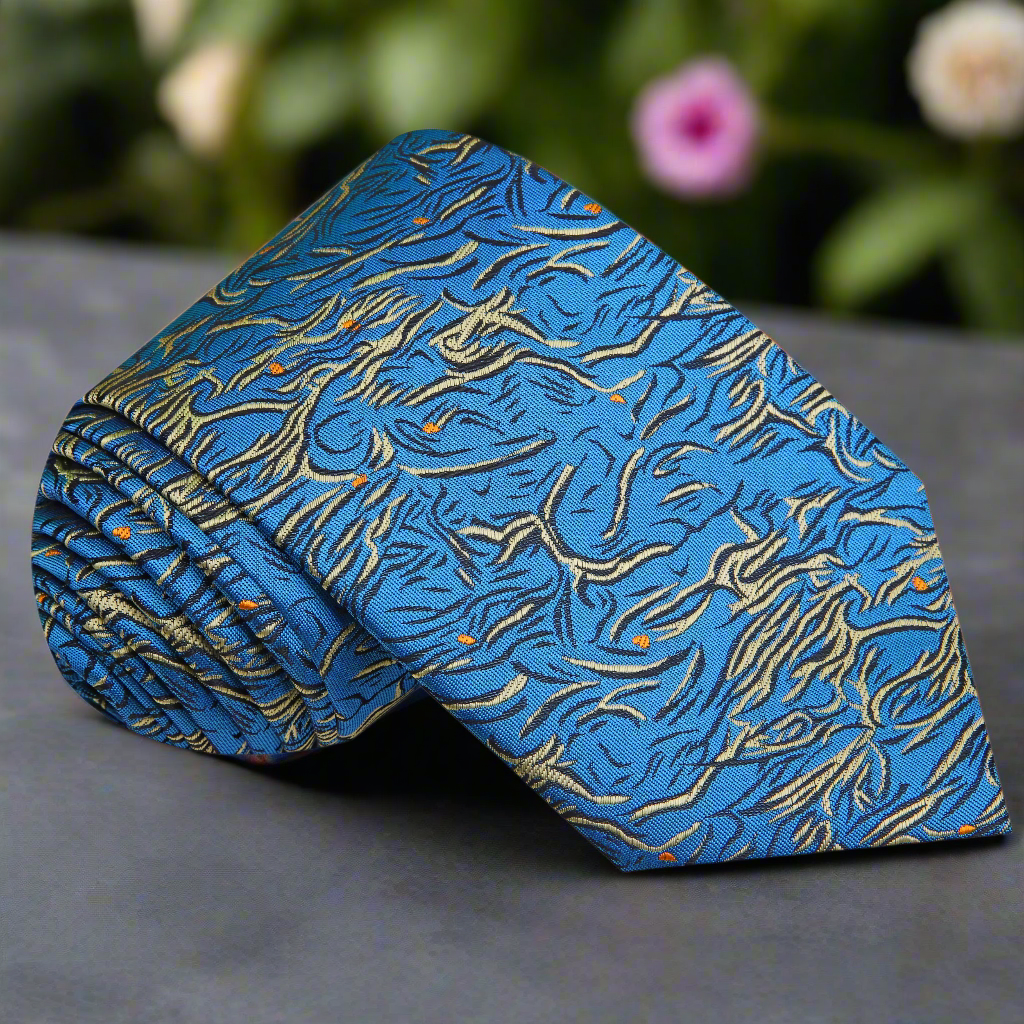 Teal silk necktie with abstract pattern laid flat for display