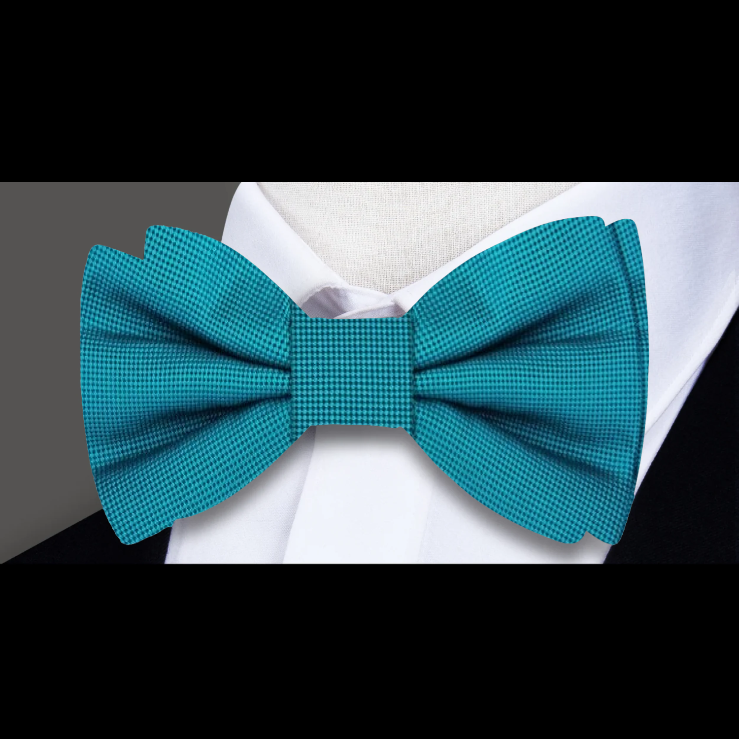 Matching pocket square with a navy blue bow tie, ideal for business meetings.