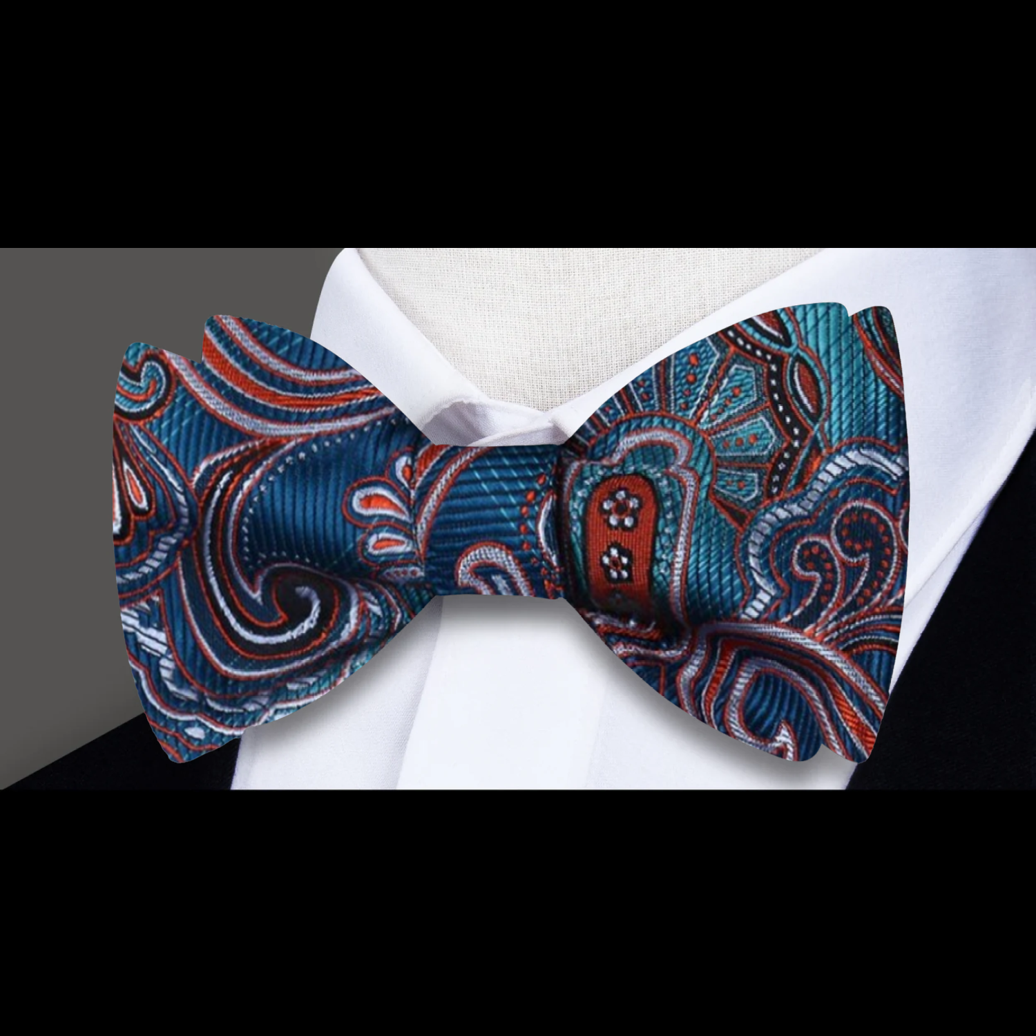 Fashionable mens silk bow tie styled with a suit for a wedding