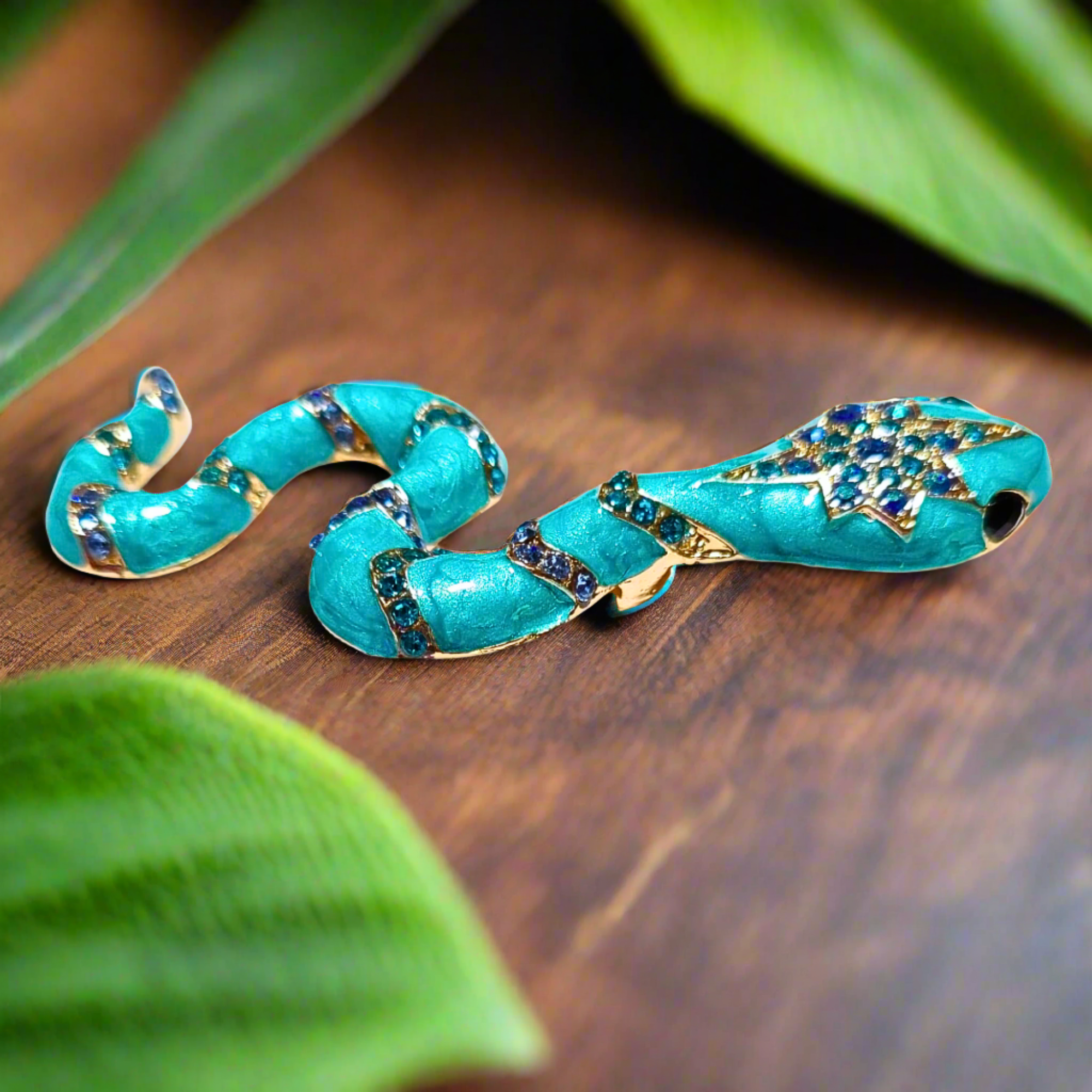 Styled image of the snake brooch on a tailored suit jacket, perfect for formal events.