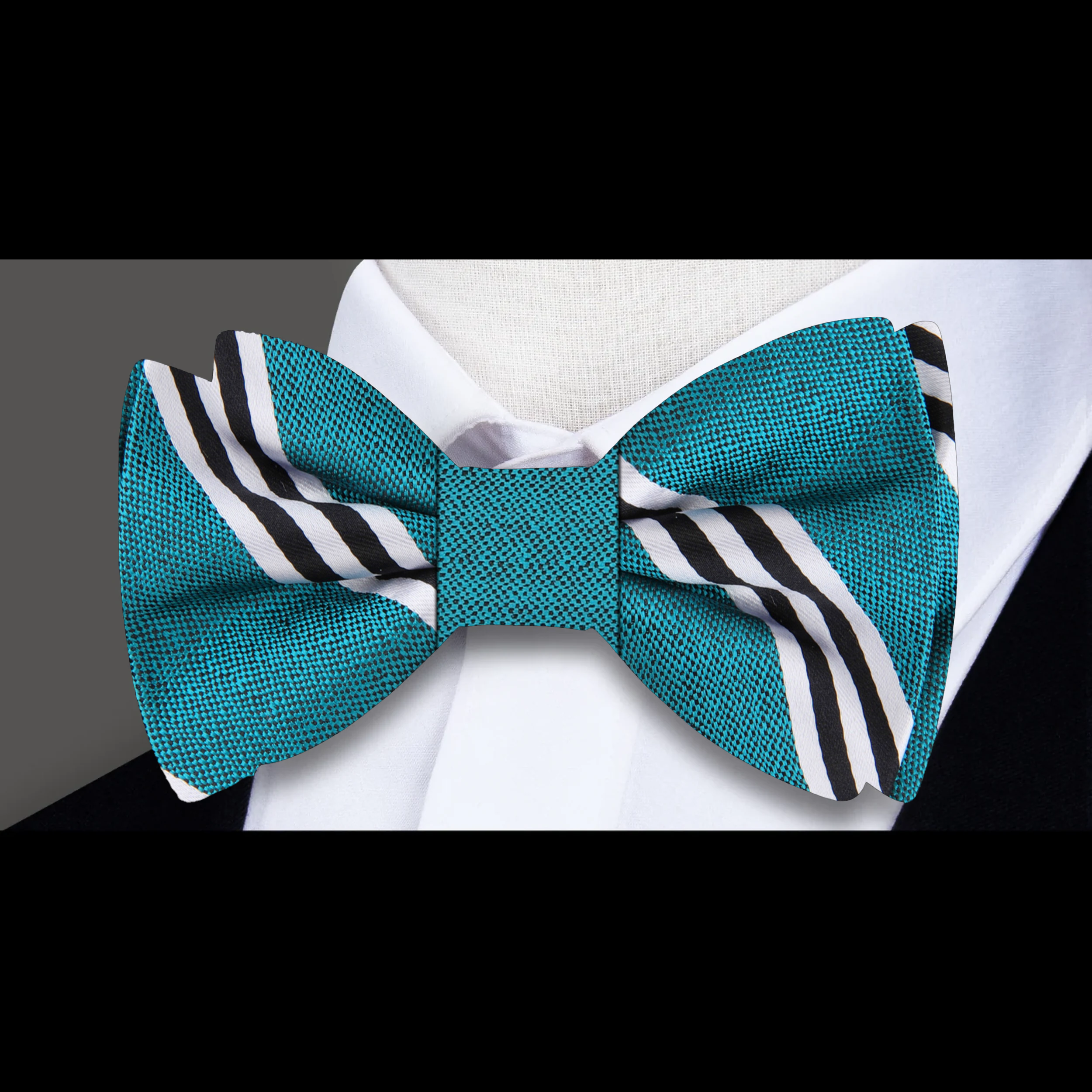 Man adjusting a pre-tied mens bow tie for wedding attire