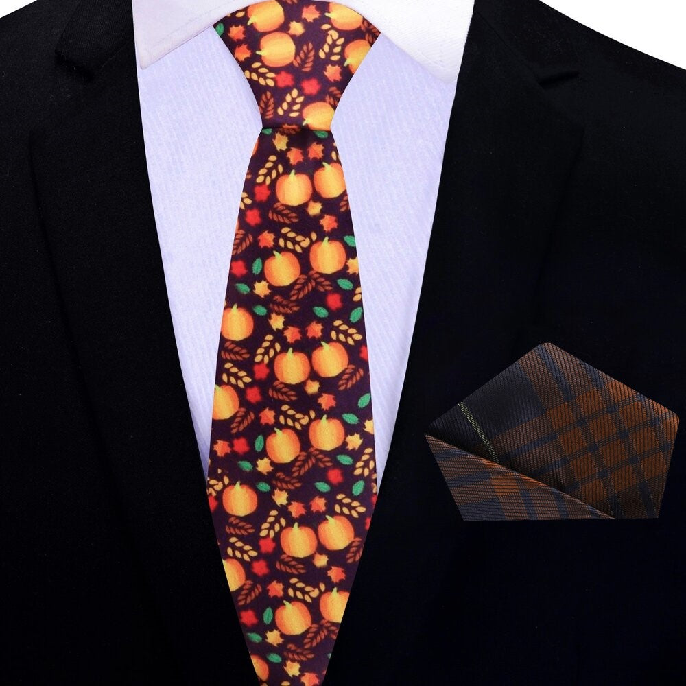 Close-up of a holiday office wear silk necktie, showcasing the intricate design of fall leaves and pumpkins.