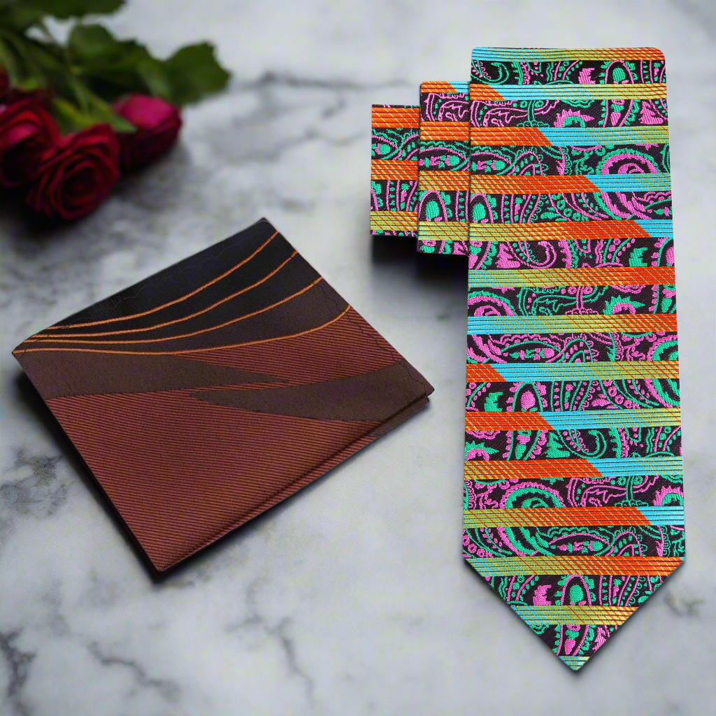 Vibrant paisley silk tie paired with a navy suit for a professional appearance.