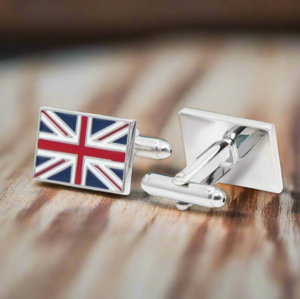 Union Jack cufflinks displayed on a crisp white dress shirt.