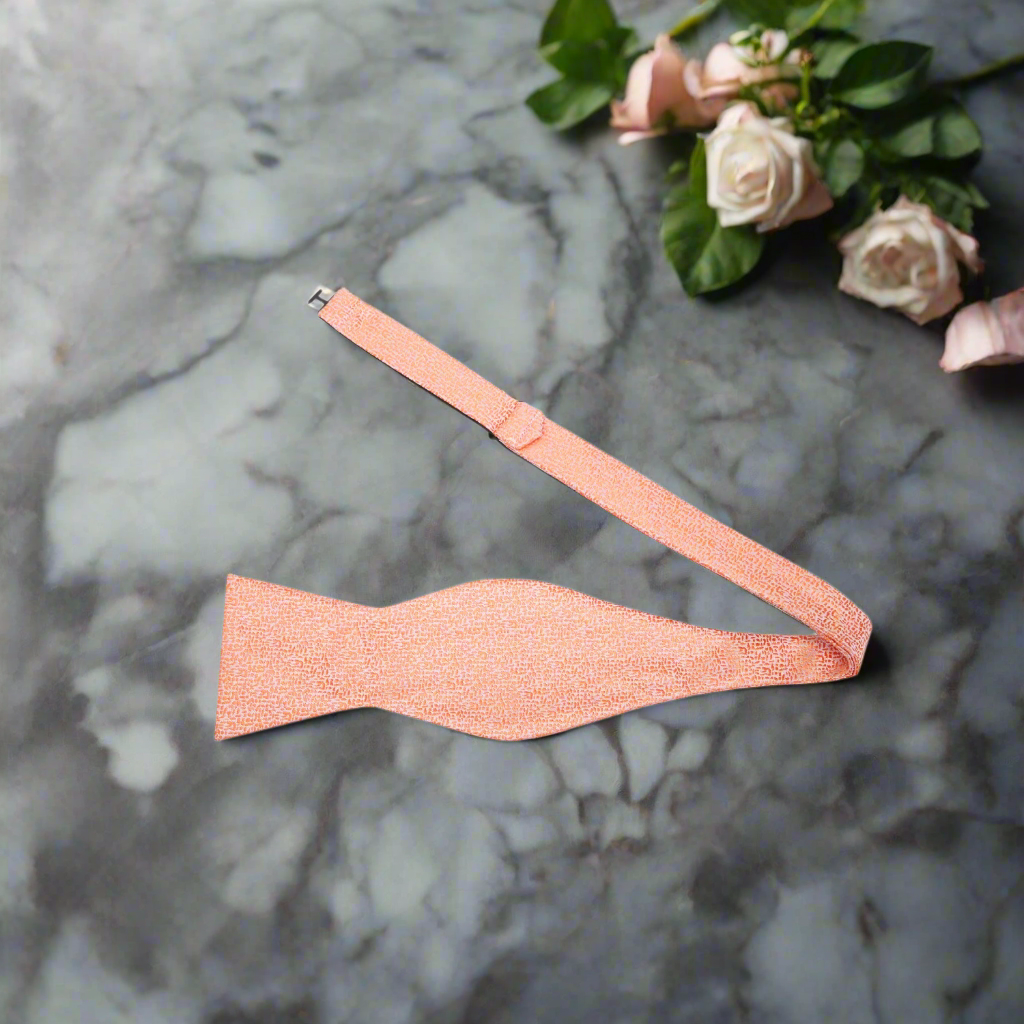 Front view of a gold textured silk bow tie, ideal for weddings and formal occasions.