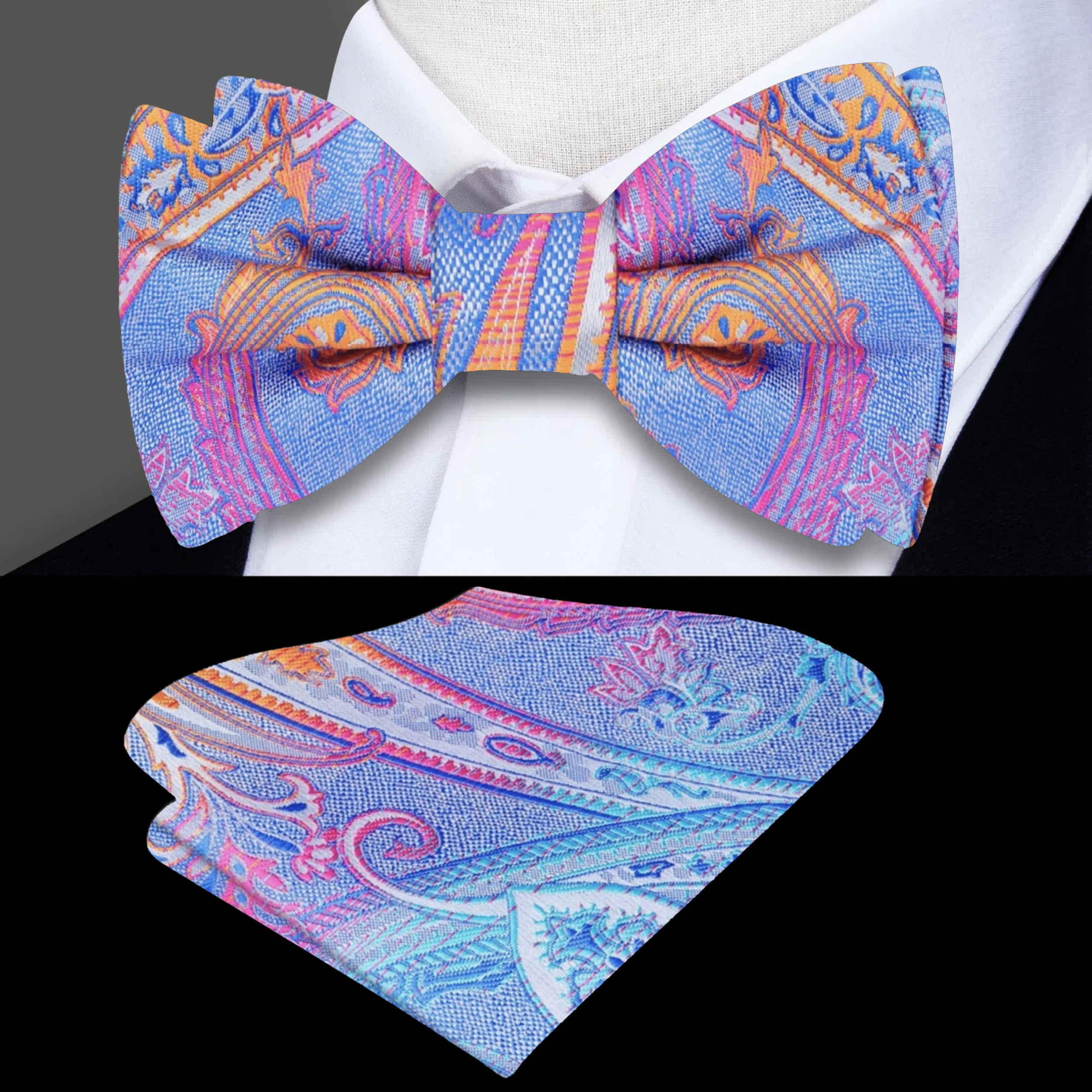 Man wearing a vibrant paisley bow tie paired with a light grey suit at a garden party.