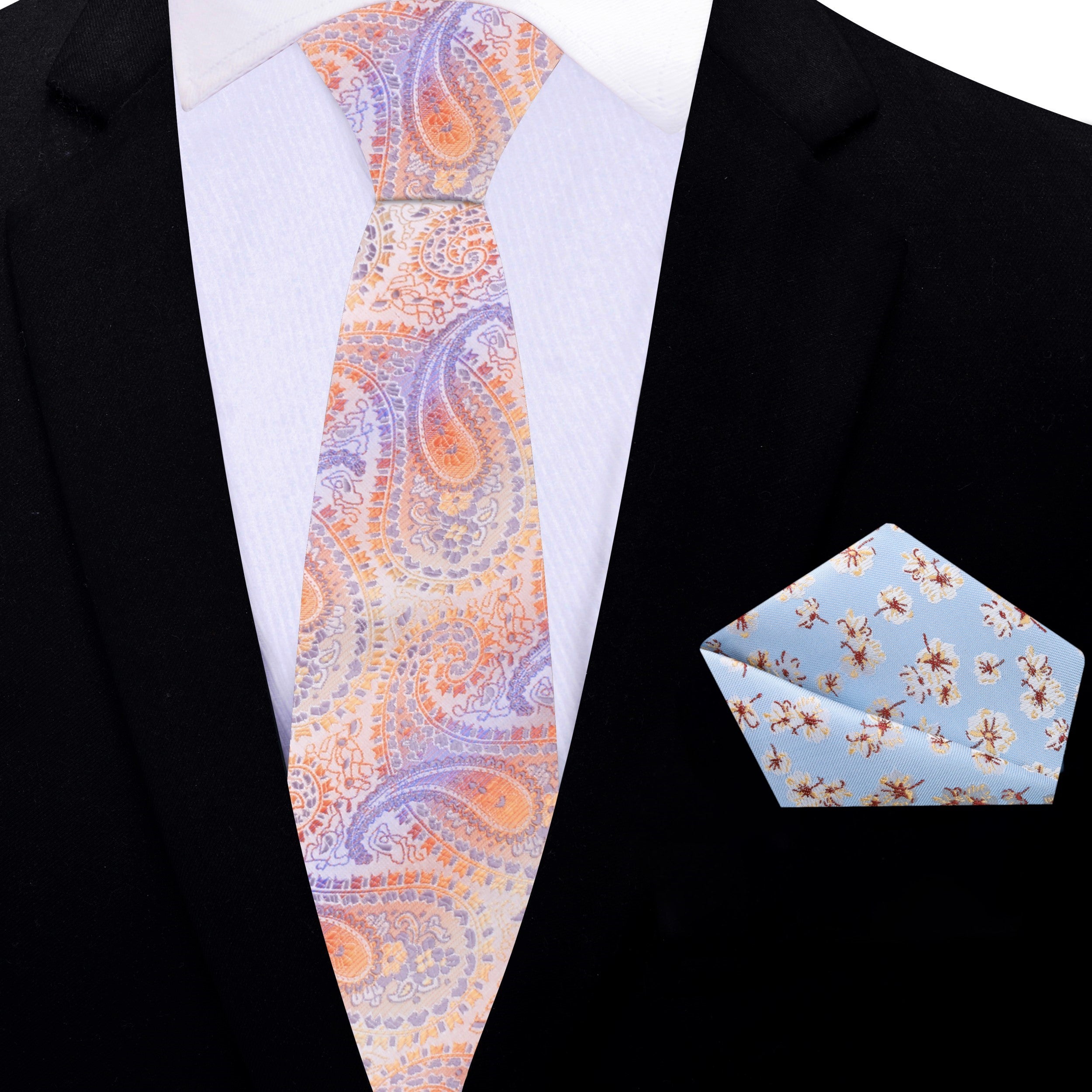 Fashionable man wearing a colorful paisley silk tie at a wedding celebration