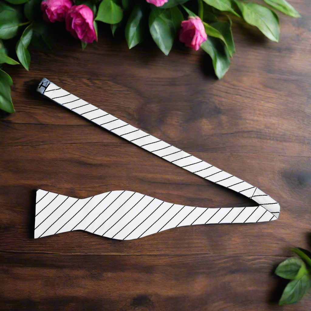 A stylish man wearing a blue and red striped bow tie at a wedding, exuding confidence and elegance.