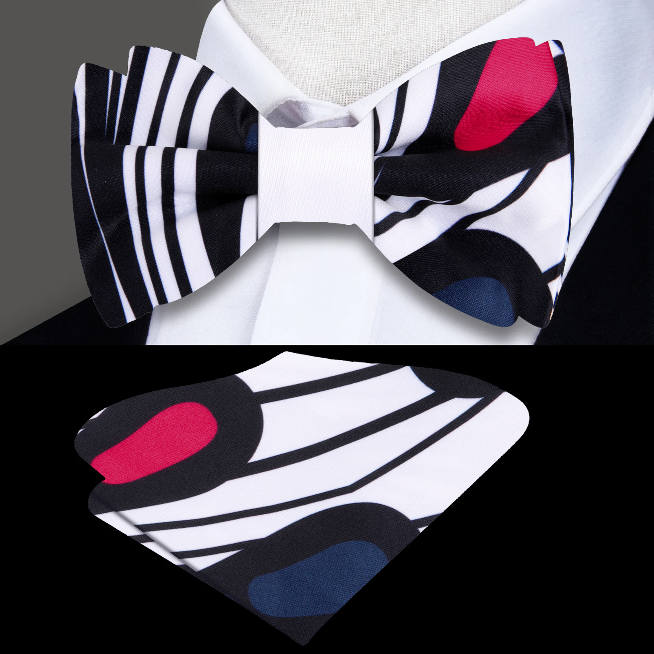 Model wearing a white bow tie with paisley design paired with a black dress shirt.