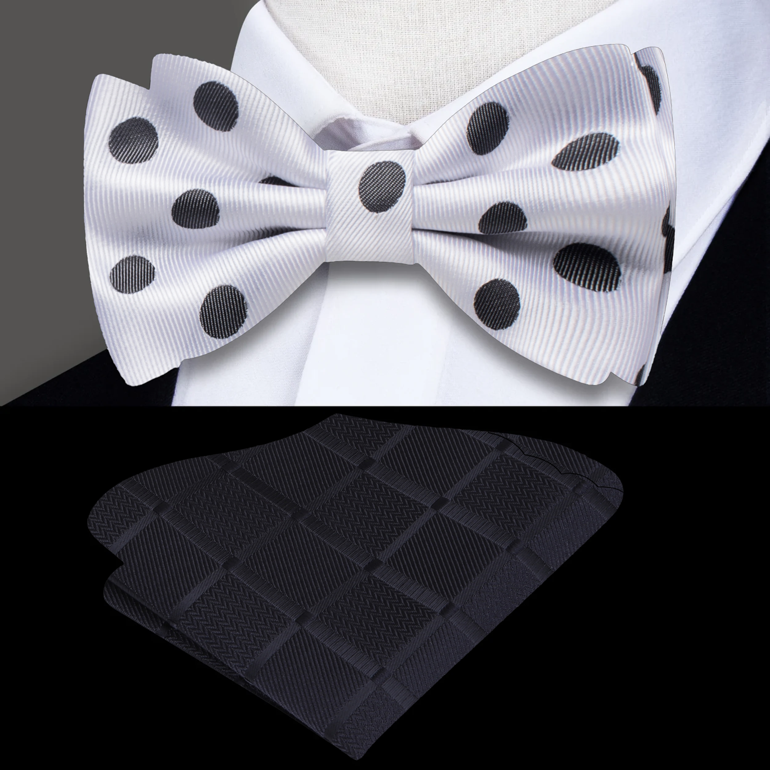 Light grey polka dot bow tie paired with a navy suit for a business dinner