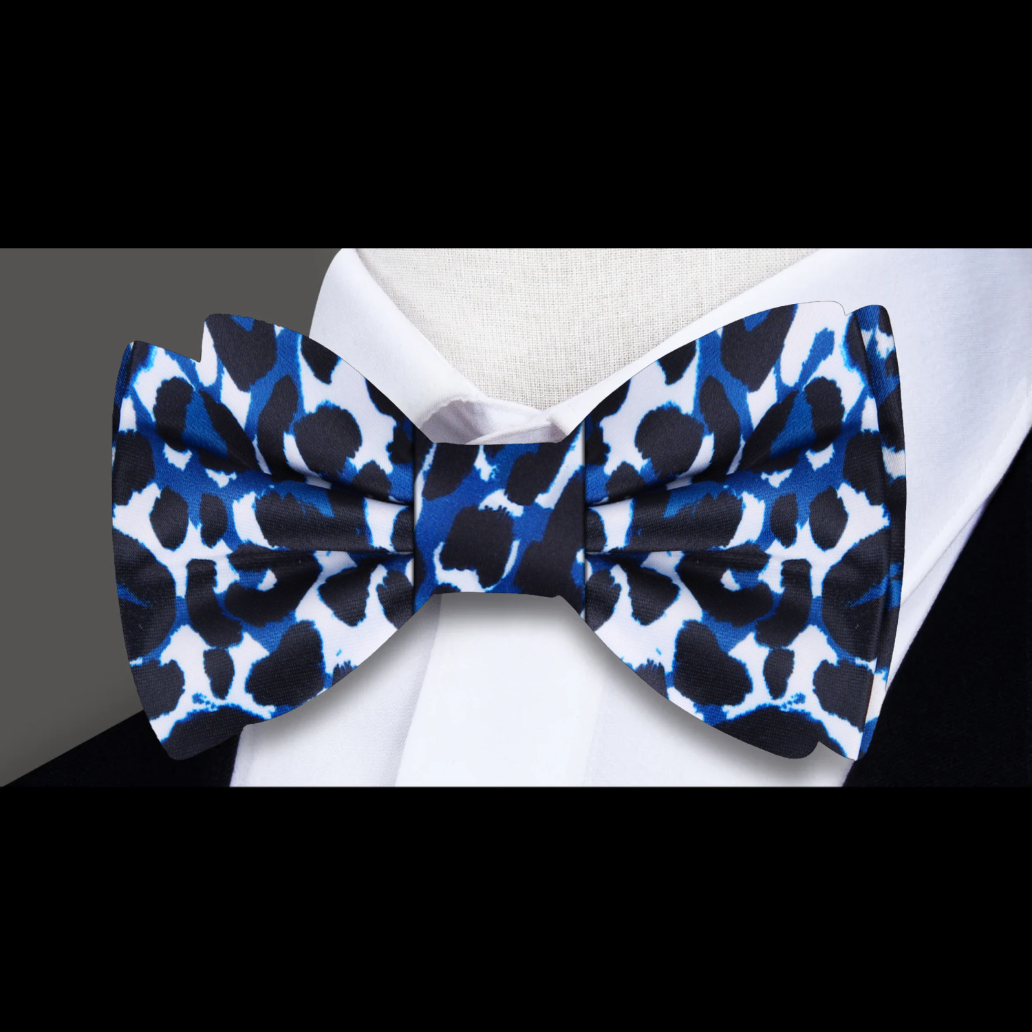 Elegant cheetah pattern silk bow tie styled with a dress shirt for formal events