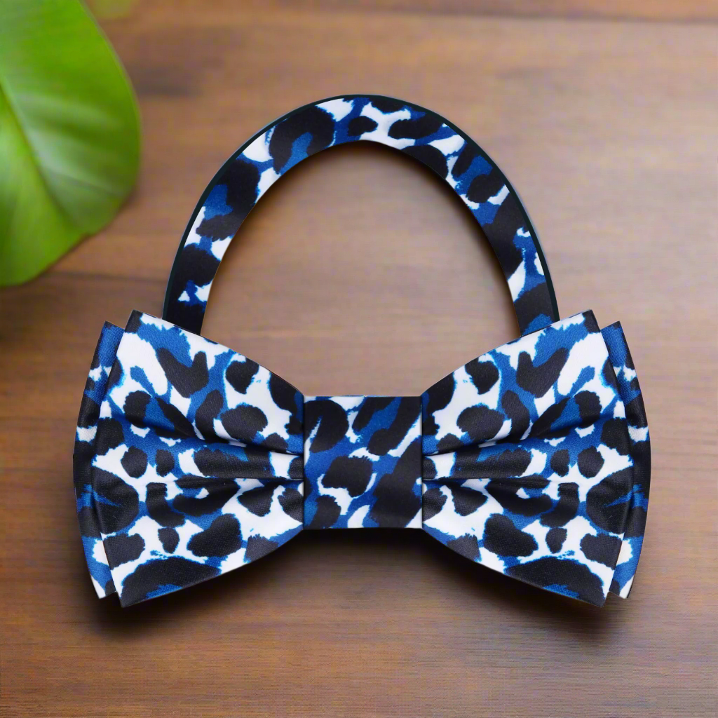 Close-up of a stylish mens bow tie with adjustable strap and wild animal print