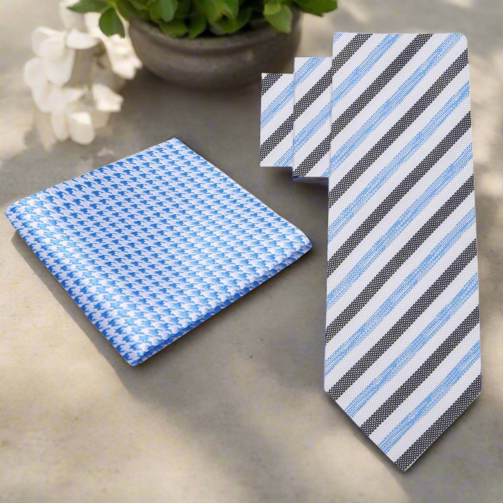 Close-up of a mens silk striped tie in white, blue, and beige