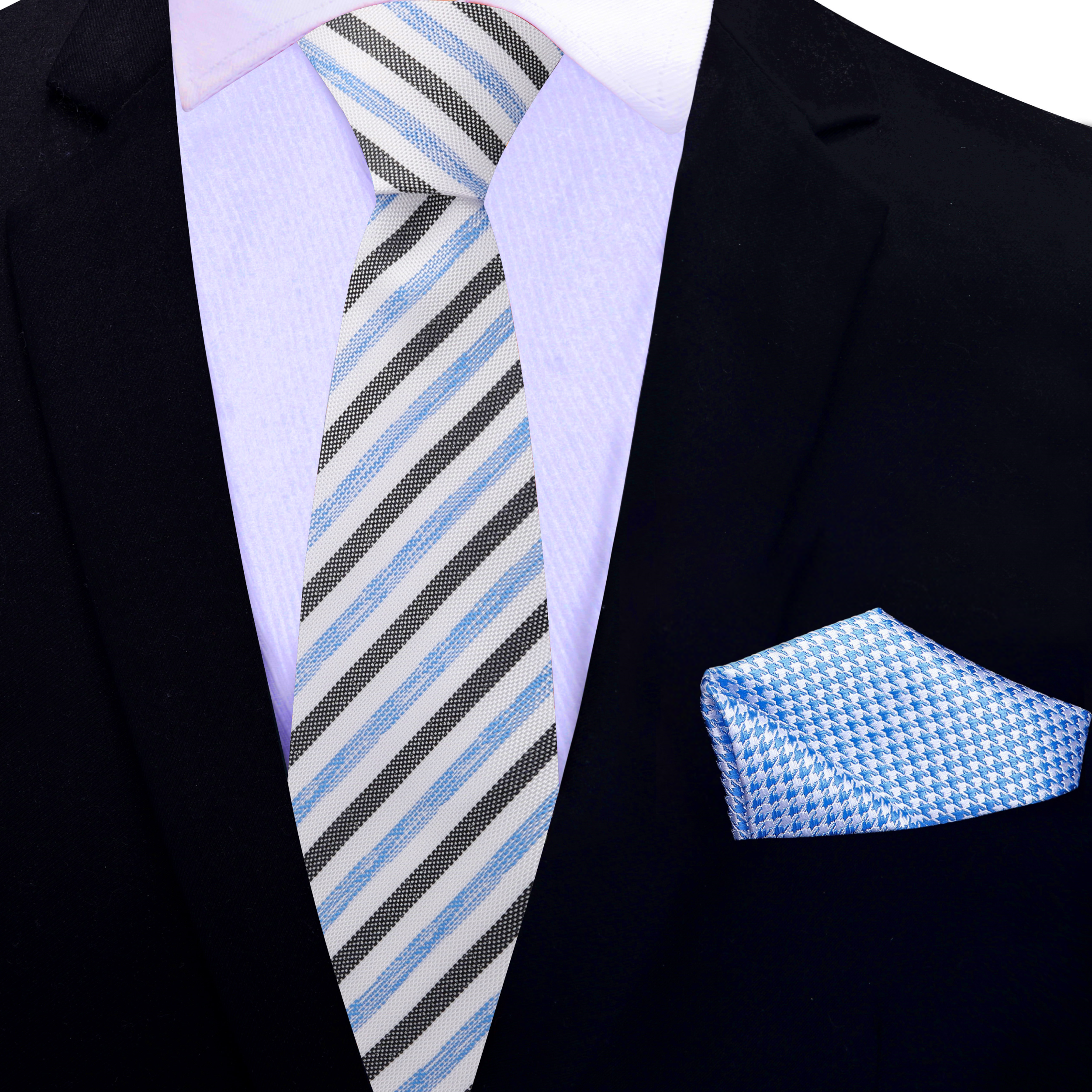 Man wearing a silk tie paired with a dress shirt and suit jacket