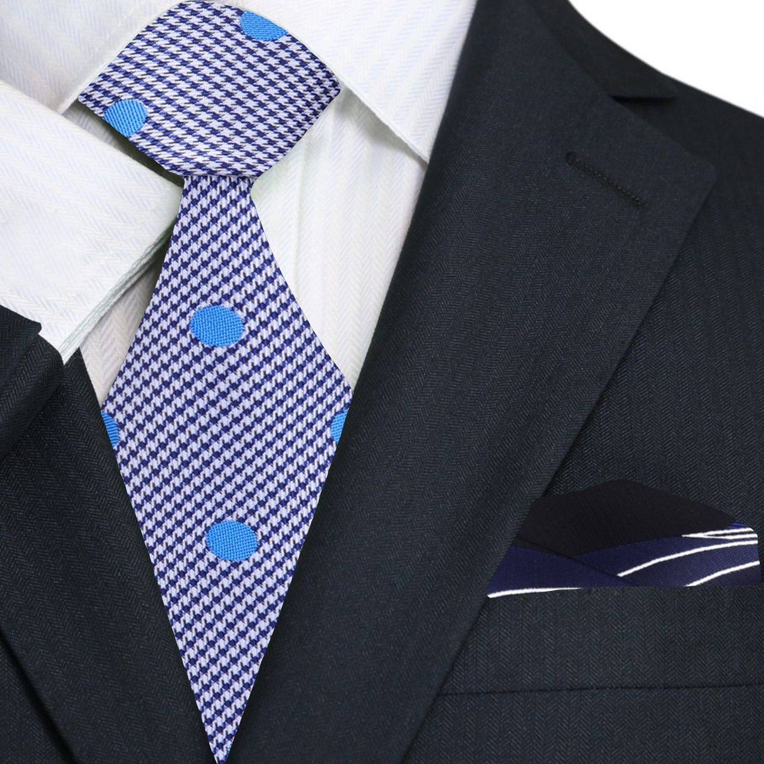 Carnegie polka dot tie styled with a navy suit and light blue shirt, perfect for business meetings