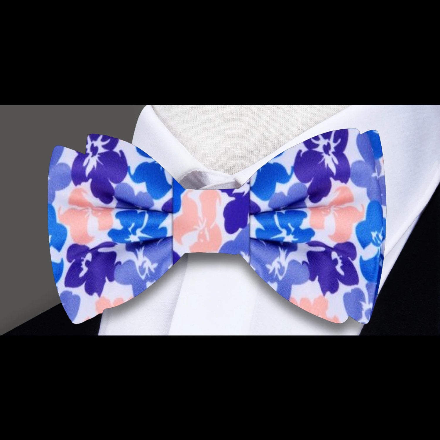 Close-up of hibiscus pattern on silk bow tie for special occasions