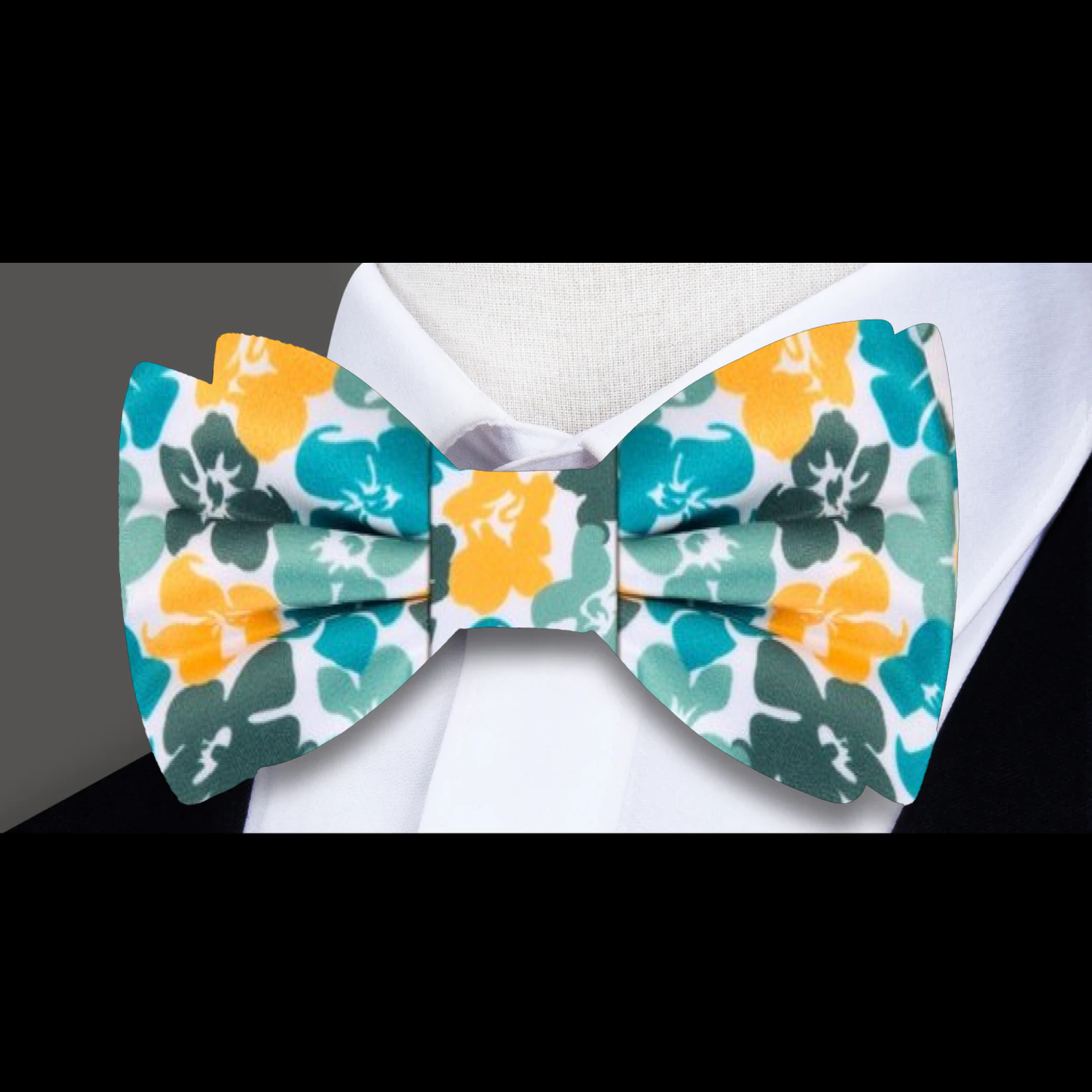 Close-up of hibiscus pattern on silk bow tie for special occasions
