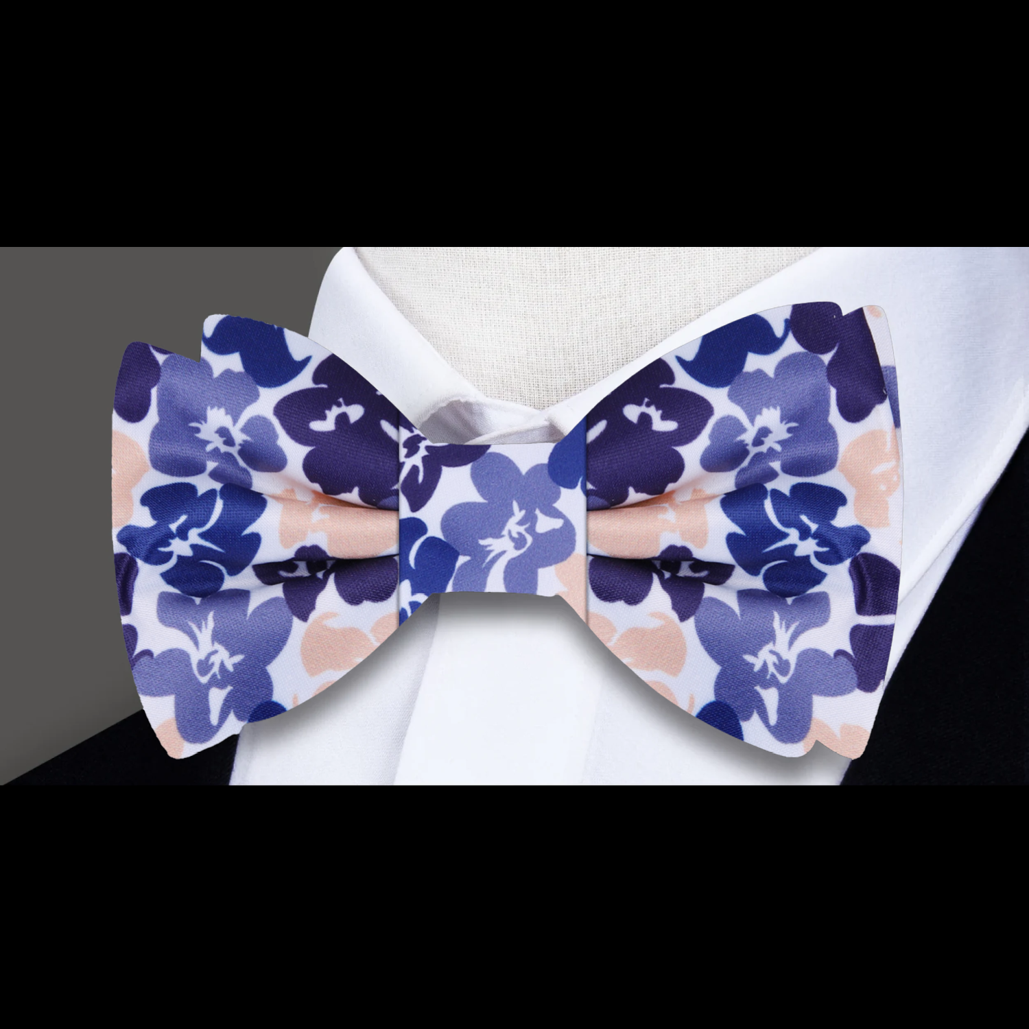 Close-up of hibiscus pattern on silk bow tie for special occasions