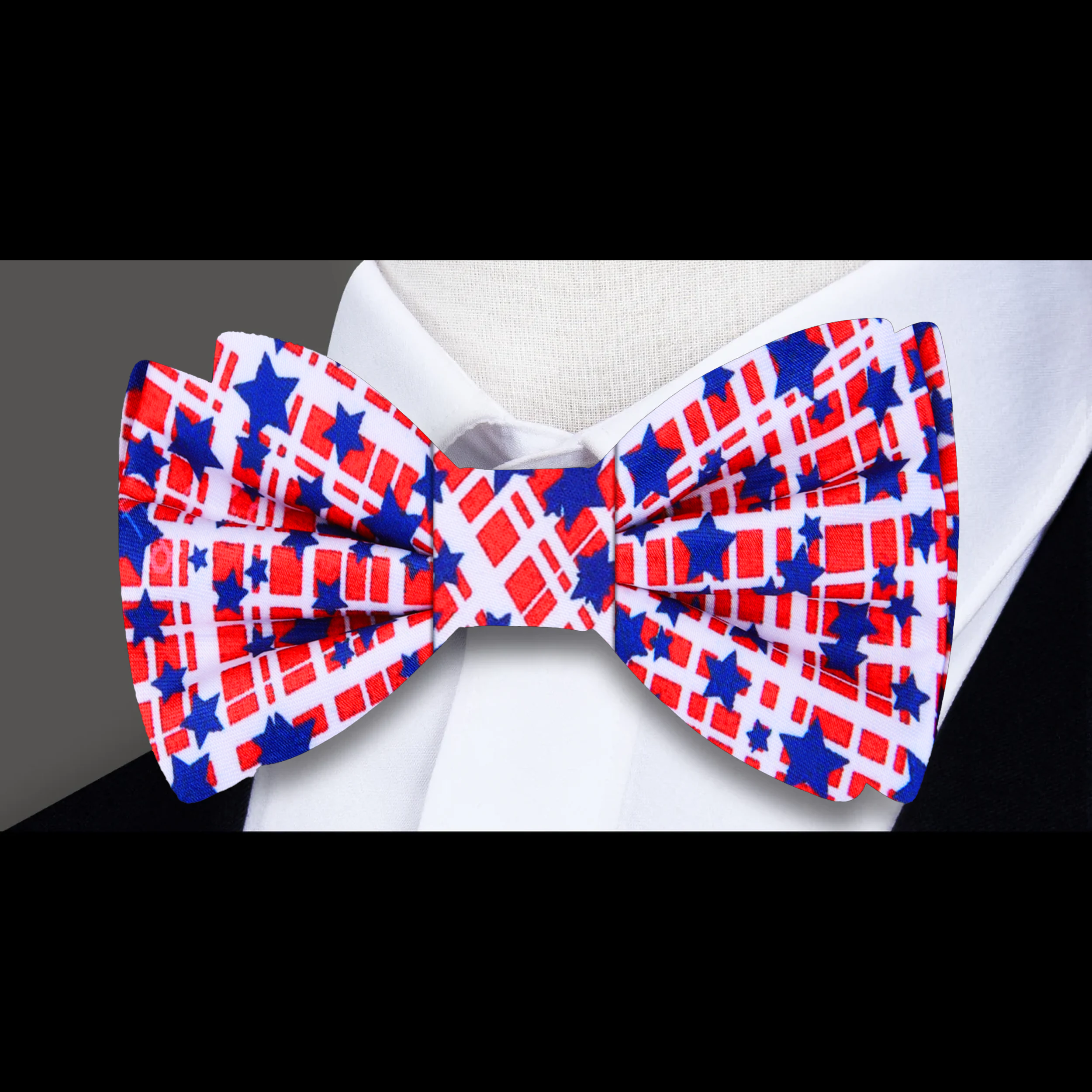 Close-up of a silk bow tie with American flag pattern for Fourth of July celebrations