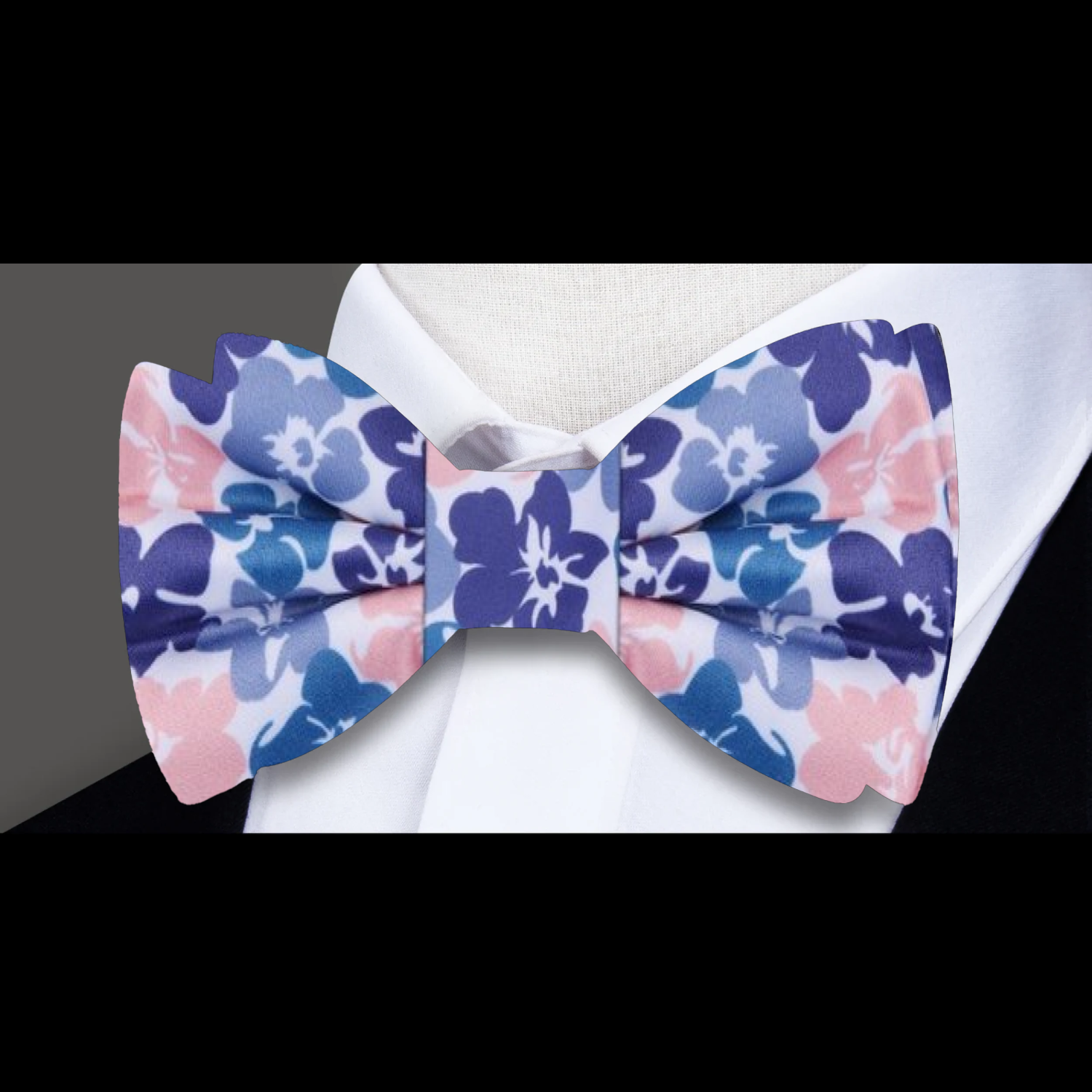 Close-up of hibiscus pattern on silk bow tie for special occasions