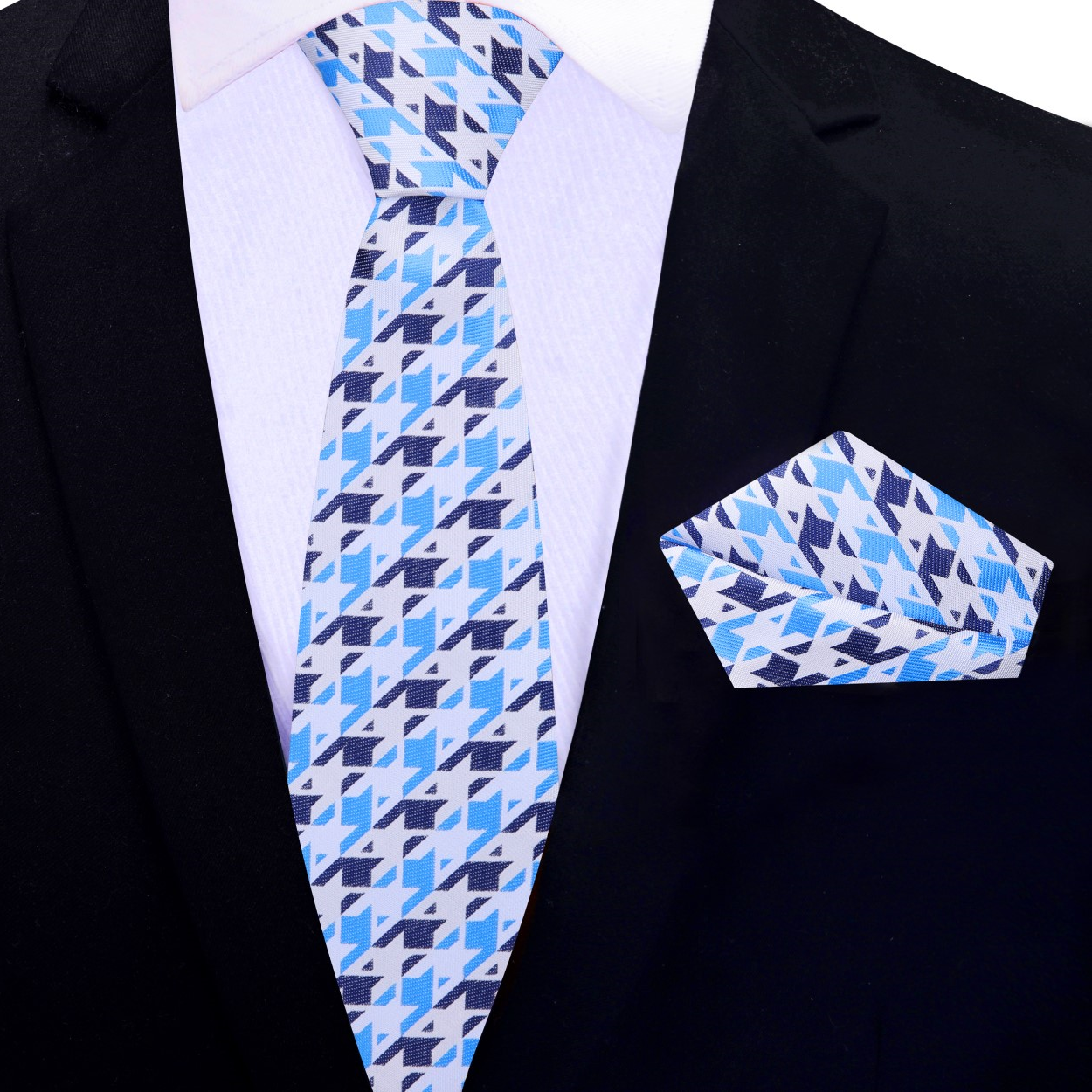Man wearing silk houndstooth tie with navy suit for corporate presentation