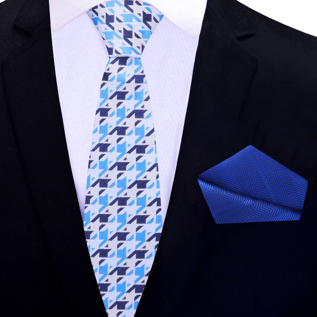 Close-up of a blue and white geometric silk tie on a dress shirt for formal occasions