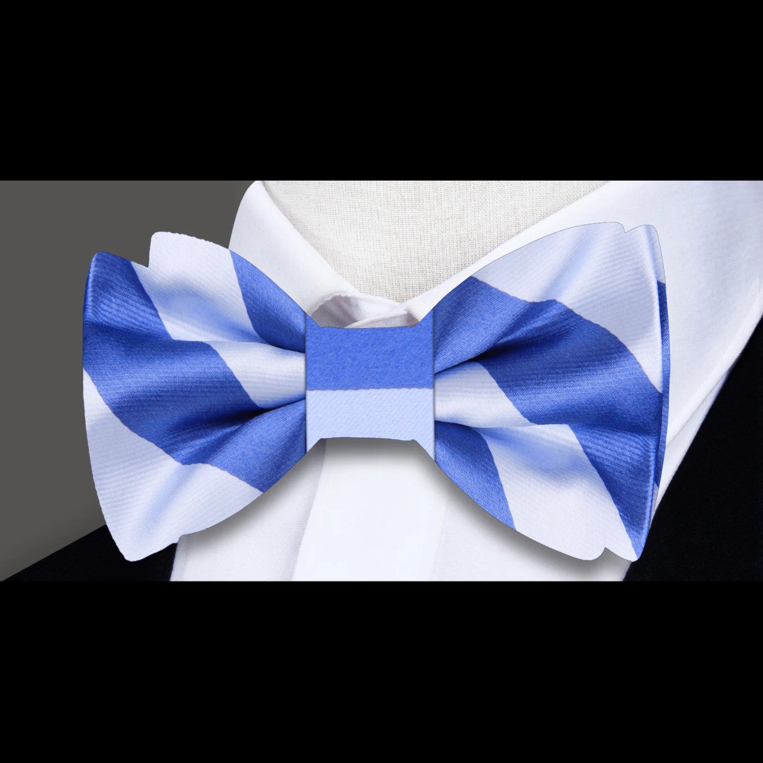 Close-up of the green and white striped silk bow tie showcasing its texture