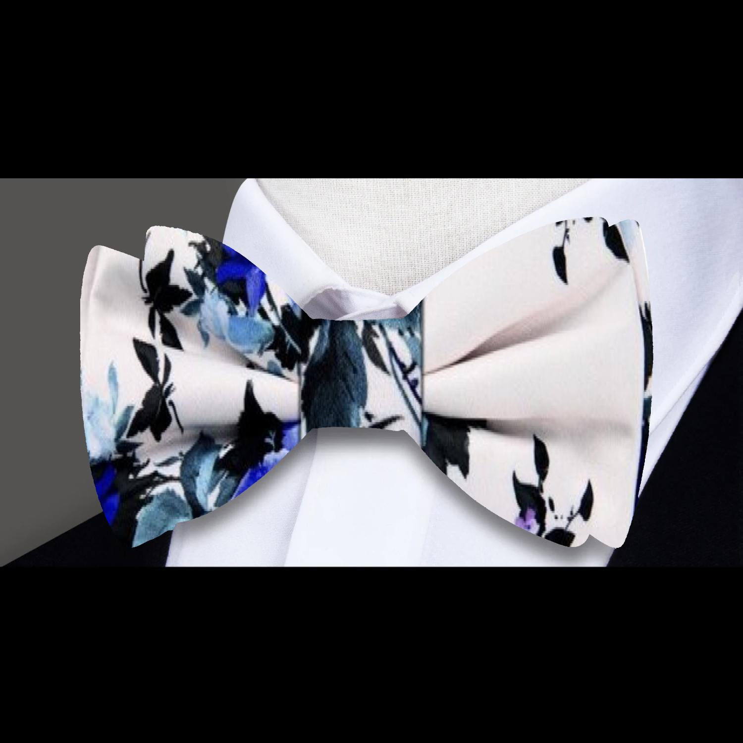 Still life-inspired bow tie styled with lavender shirt and charcoal suit