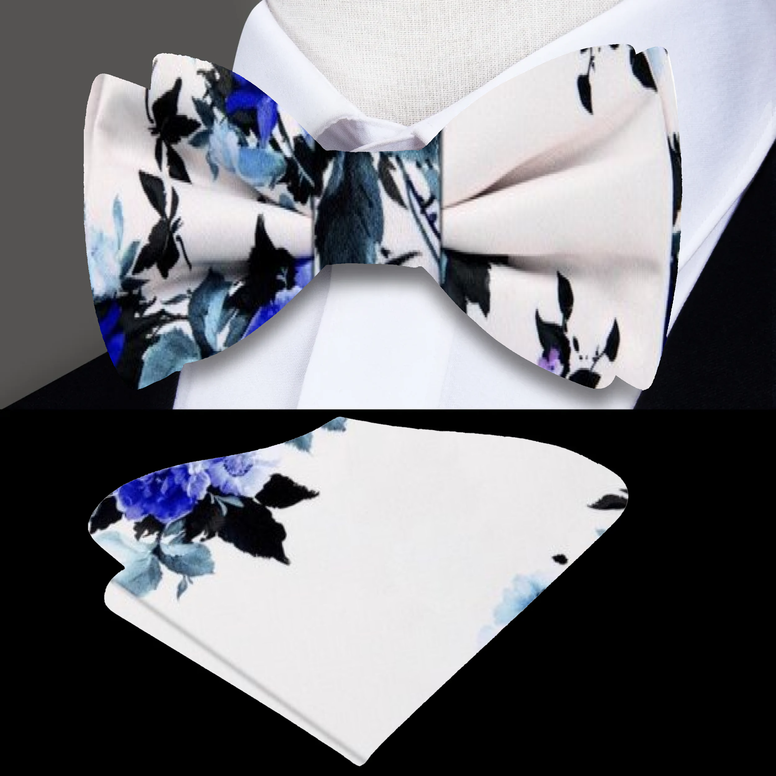 Close-up of silk floral bow tie in stormy gray with green and purple accents