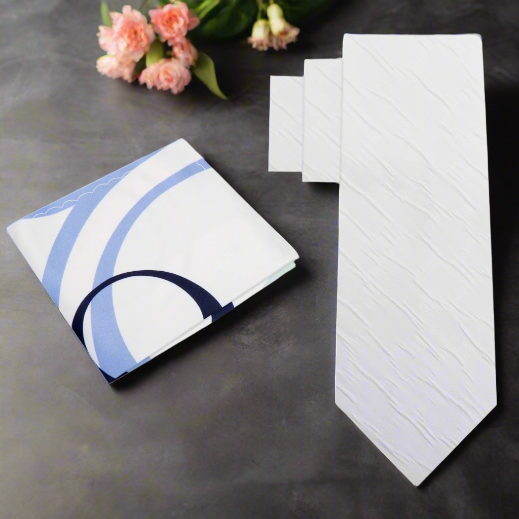 Elegant Textured White Silk Tie displayed on a formal suit, highlighting its rich texture and color.