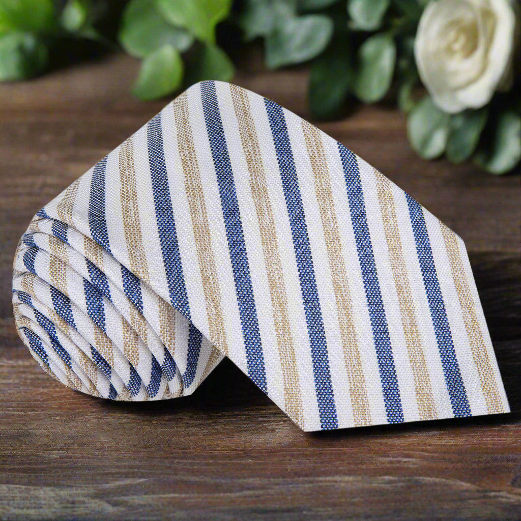 Close-up of silk men's stripe tie in white, blue, and brown showing detailed pattern