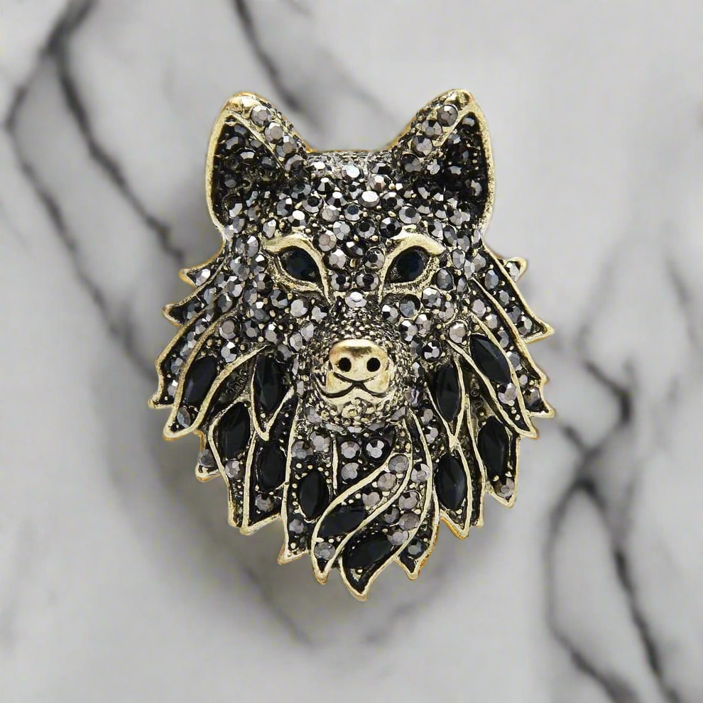 Close-up of detailed wolf head lapel pin in silver finish for mens suits
