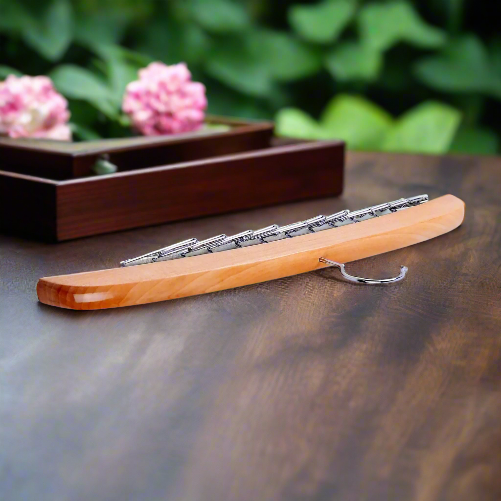 Close-up of the luxury tie organizer showing metal slots and wooden finish
