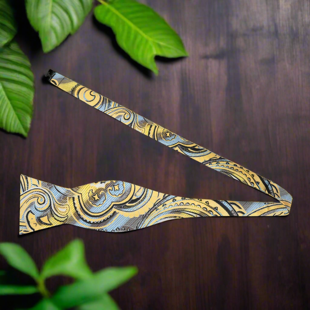 Close-up of the detailed paisley pattern on the silk bow tie, highlighting craftsmanship
