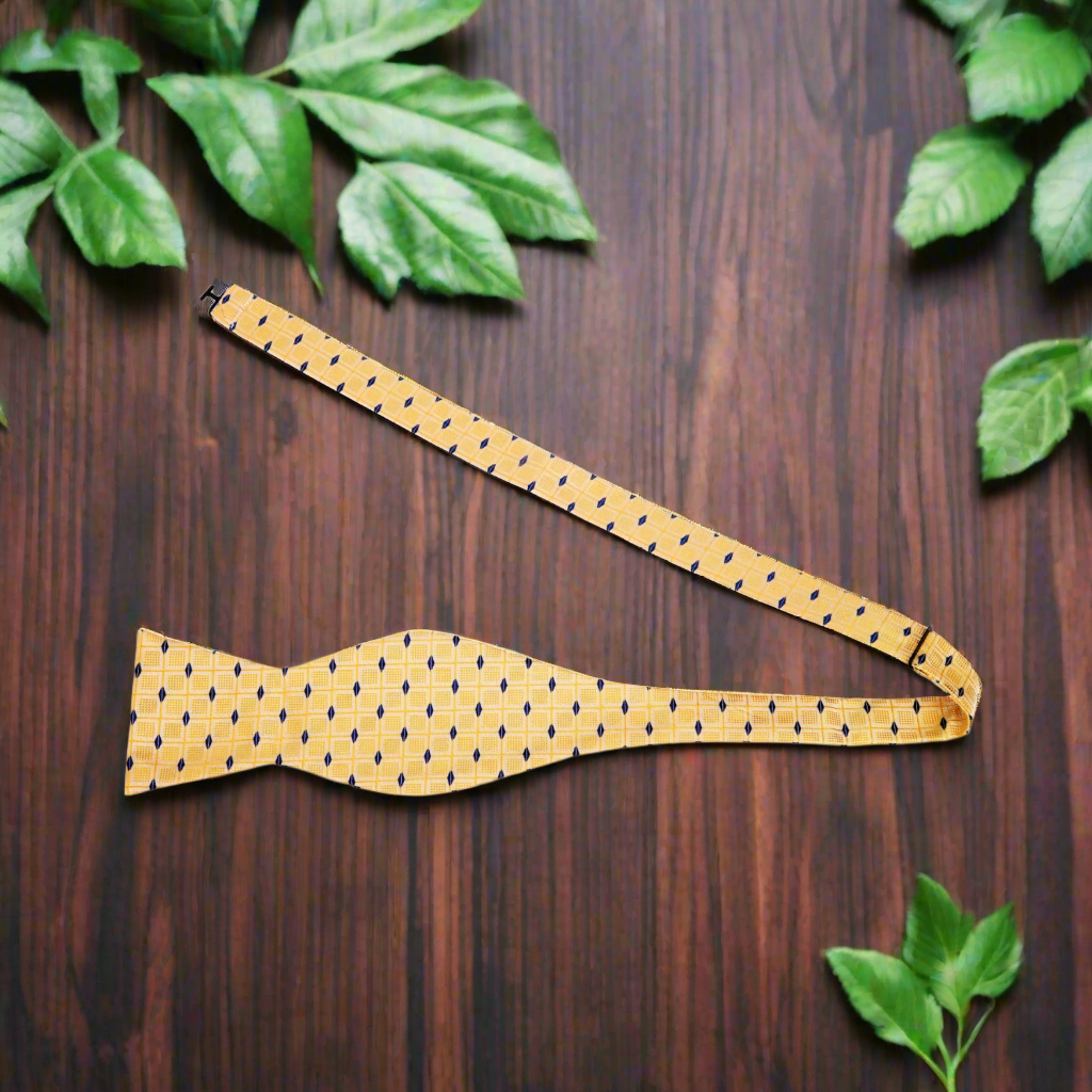 Vibrant yellow silk bow tie paired with a charcoal grey suit, perfect for business events.