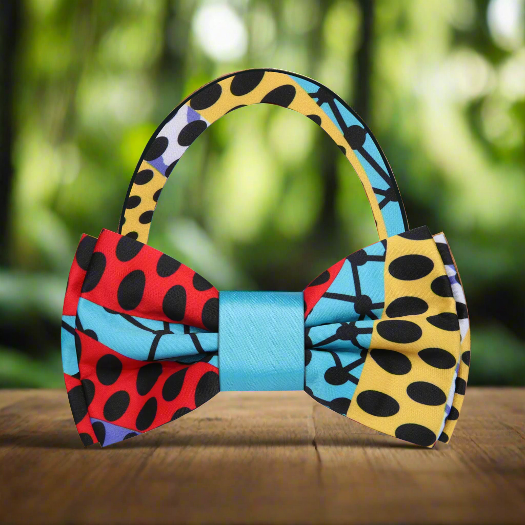 Close-up of a silk bow tie featuring Kente-inspired designs, perfect for cultural celebrations.