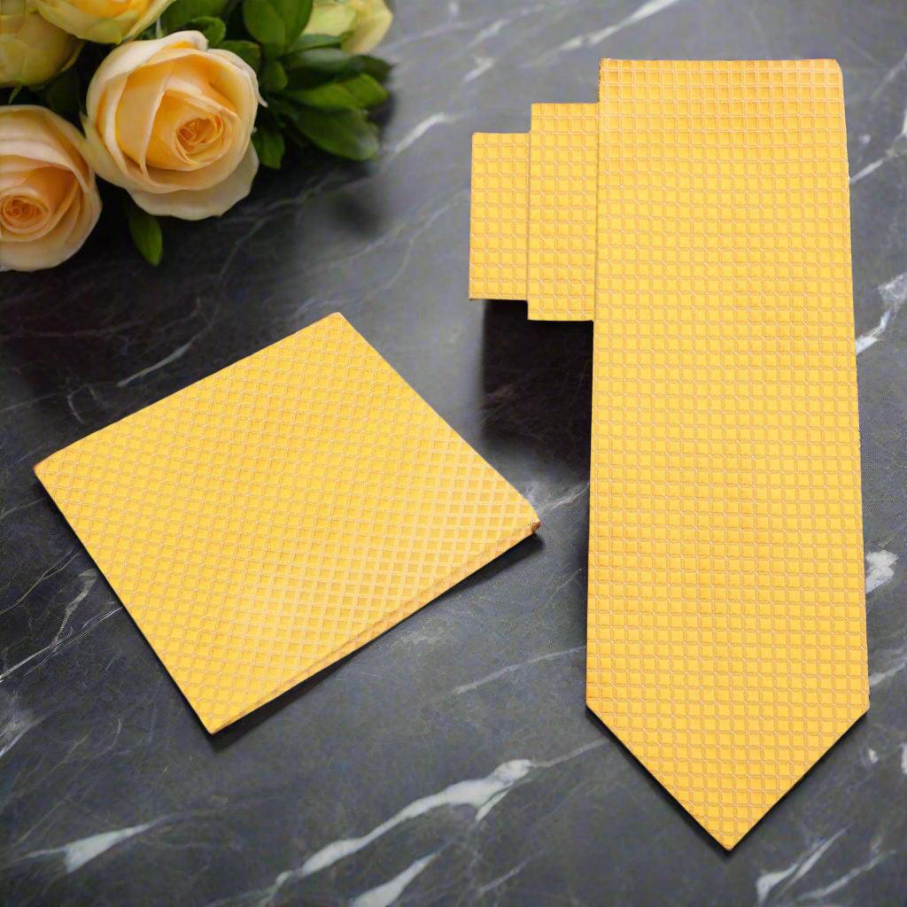 Close-up of vibrant yellow checkered mens tie showcasing its intricate pattern.