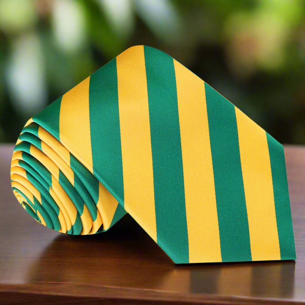 Close-up of green and yellow silk necktie with stripe pattern, ideal for weddings