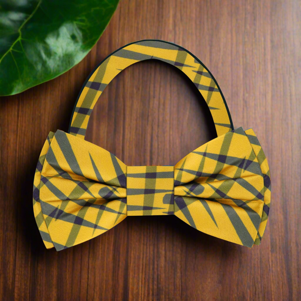 Close-up view of the Sunbeam Elegance yellow and grey jagged plaid silk bow tie for men, highlighting the intricate pattern and silk texture.