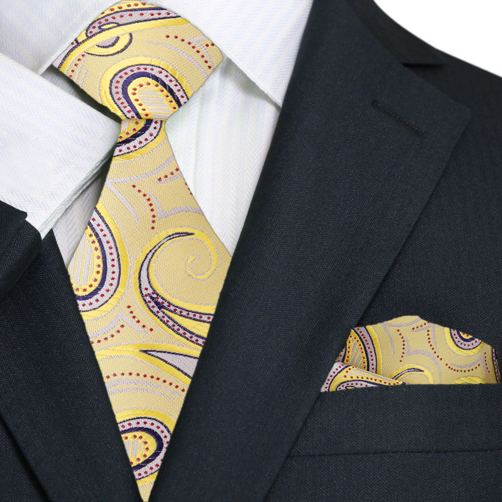 Model wearing a paisley silk tie with gold pattern paired with a white dress shirt